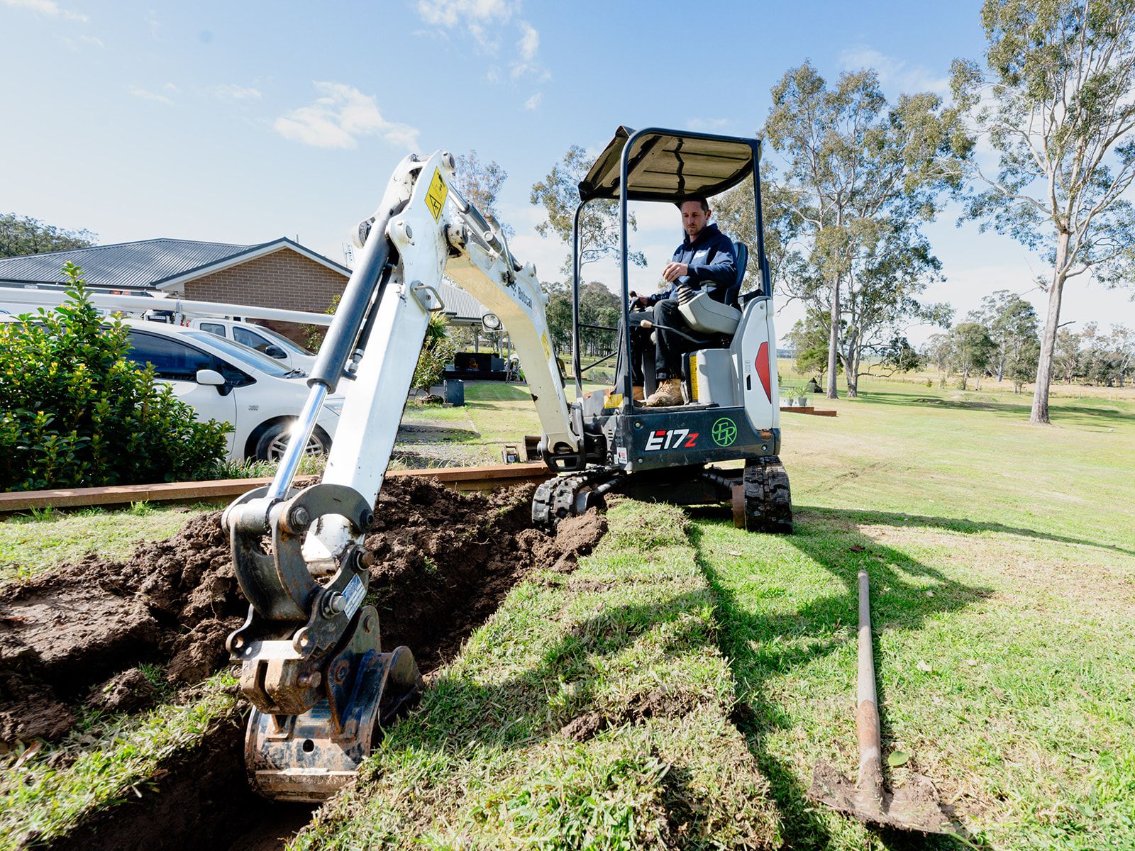 Excavating a drainage trench